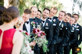 At Ramblewood Country Club, NJ, all eyes are on the embracing newlyweds as they share a perfect kiss during the reception, surrounded by their favorite people.
